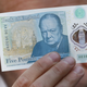 Bank of England governor Mark Carney holds up a new £5 note in September (Photo by Stefan Wermuth - WPA Pool/Getty Images)